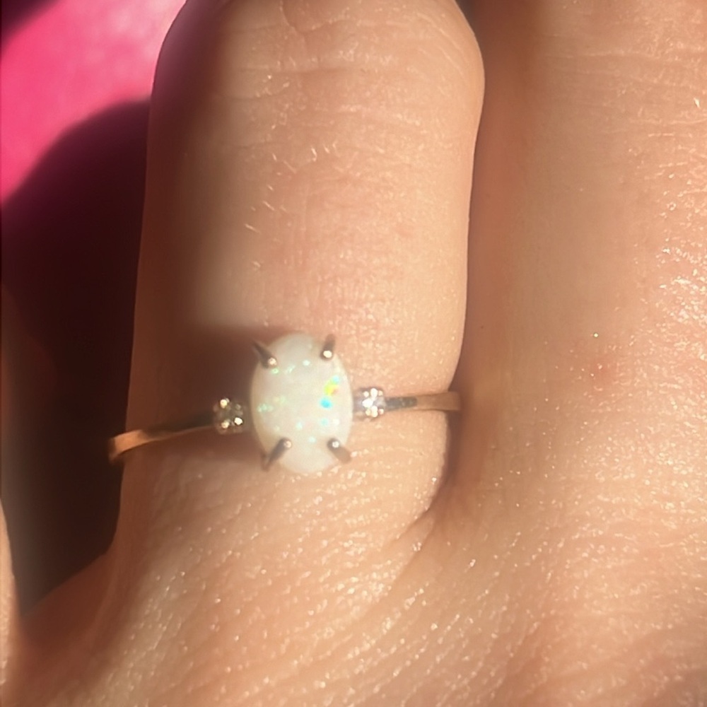 Solid 10k gold ring , genuine opal, genuine diamond chips.